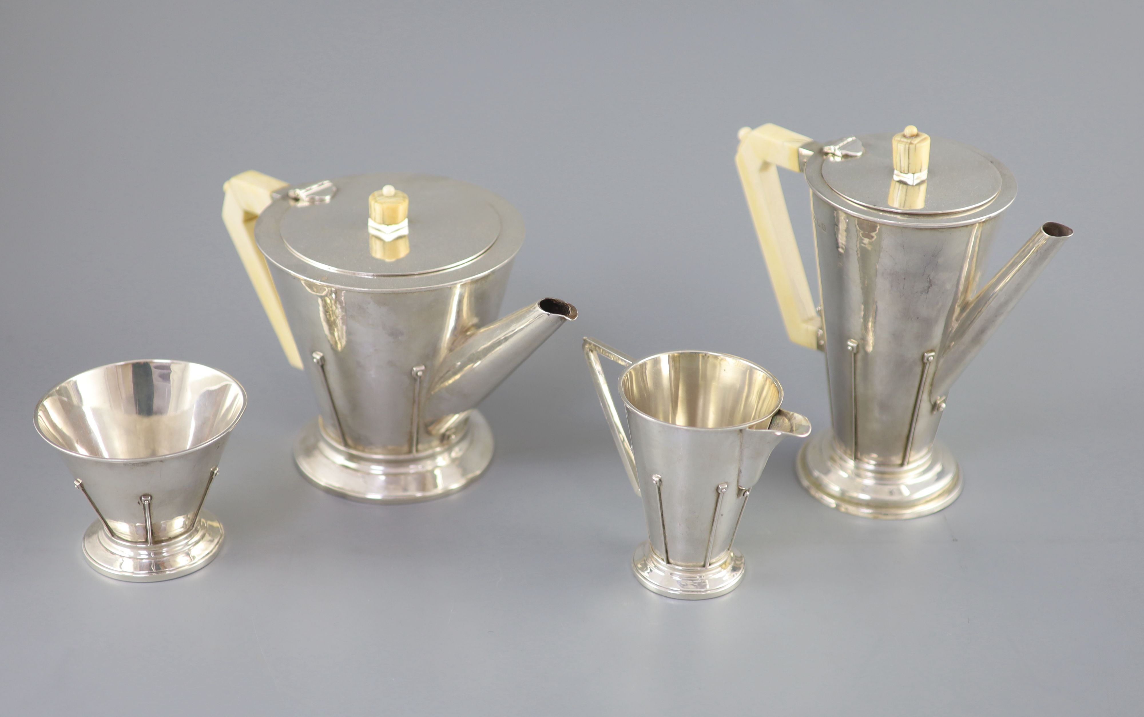 A stylish 1930s Art Deco silver four piece tea and coffee service by Charles Boyton,